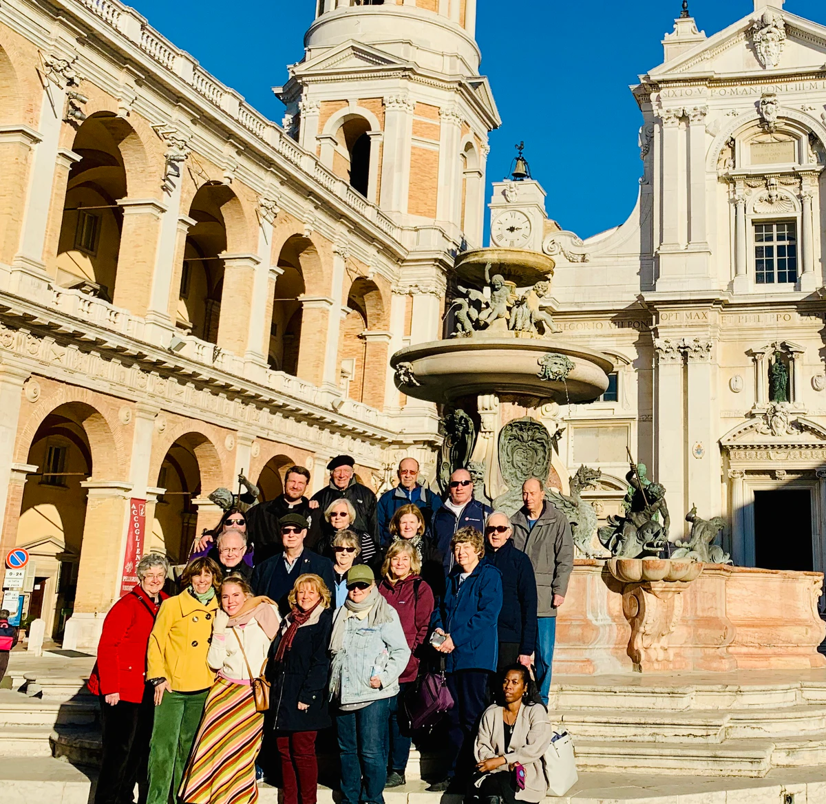 Travel group gathered in a historic plaza